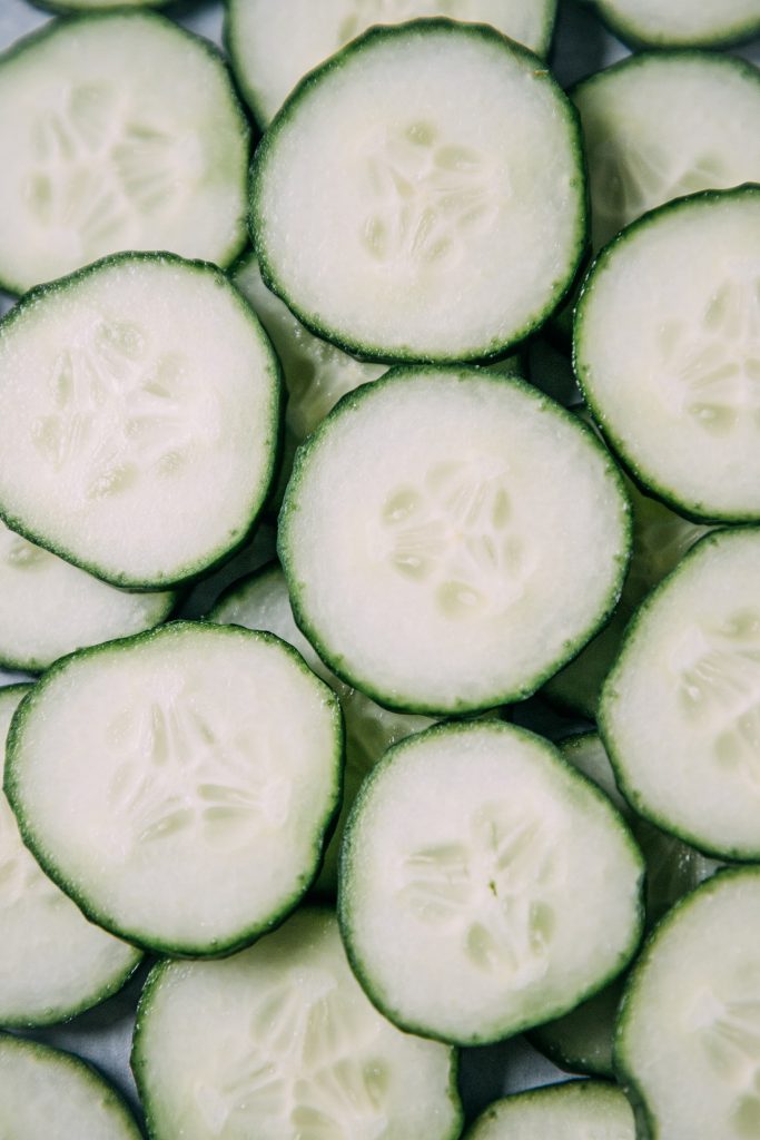 Closeup of a pile of sliced cucumbers